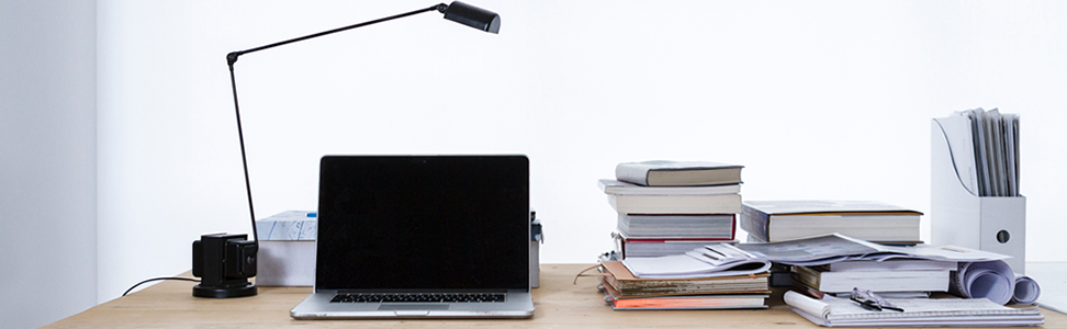 Laptop on desk book stacks photo by freddie marriage (@fredmarriage) on Unsplash